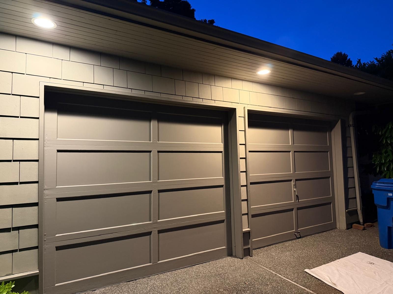 Finished garage doors and exterior lighting